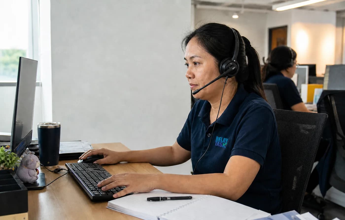 Illustration of a RelayTask support specialist working in the managed support operation