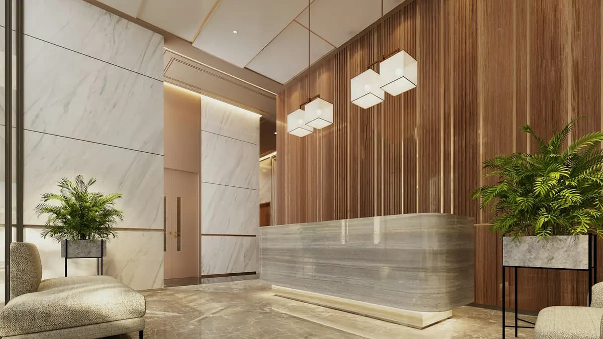 A hotel reception desk in a quiet, warmly lit lobby